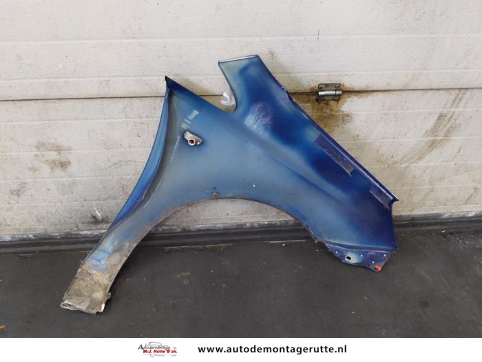 Front wing, left from a Opel Corsa D 1.3 CDTi 16V ecoFLEX 2011