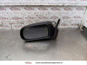 Used Wing mirror, left Mazda 626 (GF14) 1.8i 16V Price on request offered by Autodemontage M.J. Rutte B.V.