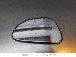 Used Mirror glass, left Suzuki Alto (RF410) 1.1 16V Price on request offered by Autodemontage M.J. Rutte B.V.