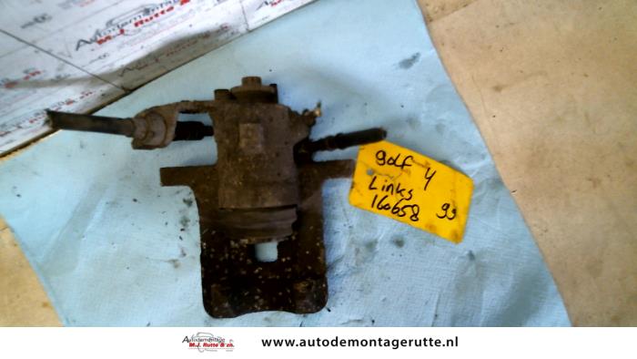 Front brake calliper, left from a Volkswagen Golf IV (1J1) 2.0 1999