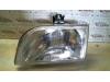 Headlight, left from a Ford Courier (FVJ) 1.3i 1995