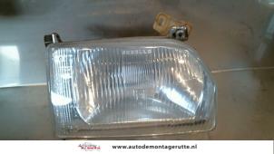 Used Headlight, right Ford Escort 4 (AAF/ABF/GAF) 1.3 Price on request offered by Autodemontage M.J. Rutte B.V.