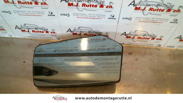 Mirror glass, left from a Mercedes-Benz 200-280 (W123) 200 1982