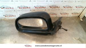 Used Wing mirror, left Mitsubishi Colt (CJ) 1.3 GL,GLX 12V Price on request offered by Autodemontage M.J. Rutte B.V.