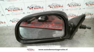 Used Wing mirror, left Mitsubishi Colt (CA/CC) 1.3 i GL,EL 12V Price on request offered by Autodemontage M.J. Rutte B.V.
