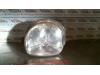 Headlight, left from a Renault Twingo (C06) 1.2 16V 2002