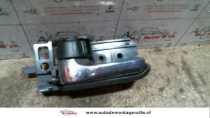 Used Rear door handle 4-door, left Toyota Avensis Wagon (T25/B1E) 2.2 D-4D 16V Price on request offered by Autodemontage M.J. Rutte B.V.