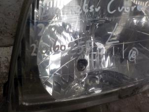 Used Headlight, left Daihatsu Cuore (L251/271/276) 1.0 12V Price € 35,00 Margin scheme offered by Boels Autodemontage