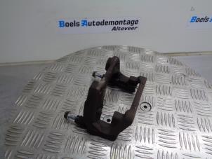 Used Rear brake calliperholder, left BMW 5 serie (F10) 518d 16V Price € 25,00 Margin scheme offered by Boels Autodemontage