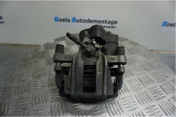 Rear brake calliper, left from a Volkswagen Caddy Cargo V (SBA/SBH) 2.0 TDI BlueMotionTechnology 2022