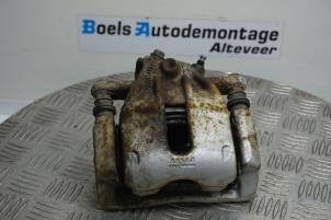 Used Front brake calliper, left Nissan Micra (K12) 1.2 16V Price € 35,00 Margin scheme offered by Boels Autodemontage