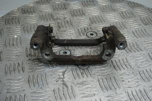 Used Rear brake calliperholder, left Opel Astra J Sports Tourer (PD8/PE8/PF8) 1.4 Turbo 16V Price € 15,00 Margin scheme offered by Boels Autodemontage
