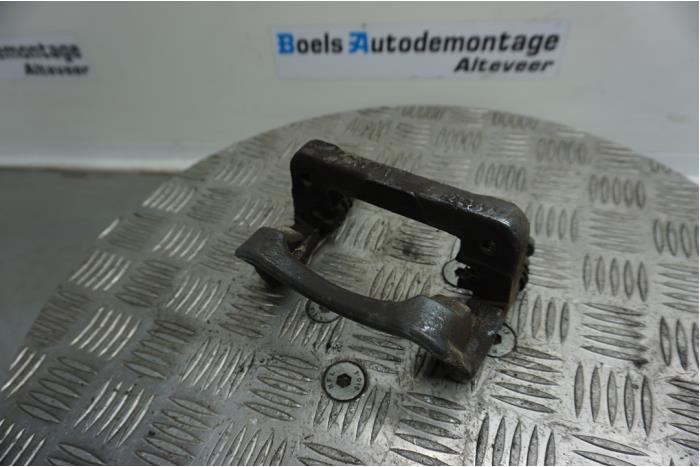 Rear brake calliperholder, left from a Vauxhall Insignia Mk.I 2.8 VXR V6 Turbo Ecotec 24V 4x4 2013