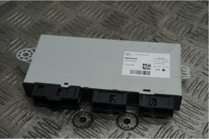 Central door locking module from a BMW X3 (F25) sDrive 28i 2.0 16V Twin Power Turbo 2016