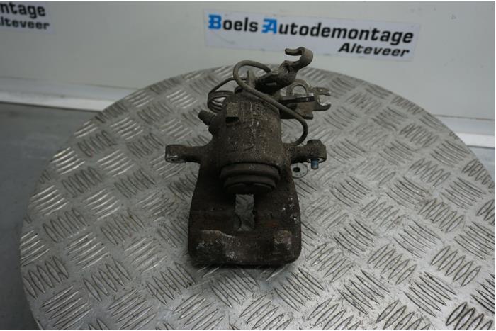 Rear brake calliper, left from a Volkswagen Caddy III (2KA,2KH,2CA,2CH) 2.0 SDI 2005