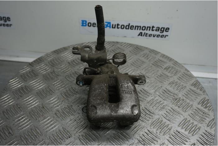 Rear brake calliper, left from a Volkswagen Caddy III (2KA,2KH,2CA,2CH) 2.0 SDI 2005