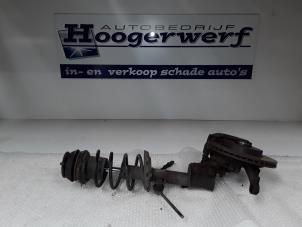 Used Front shock absorber rod, left Opel Corsa C (F08/68) 1.2 16V Price € 45,00 Margin scheme offered by Autobedrijf Hoogerwerf