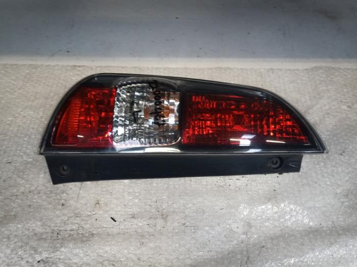Set of taillights, left + right from a Daihatsu Sirion 2 (M3) 1.3 16V DVVT 2008