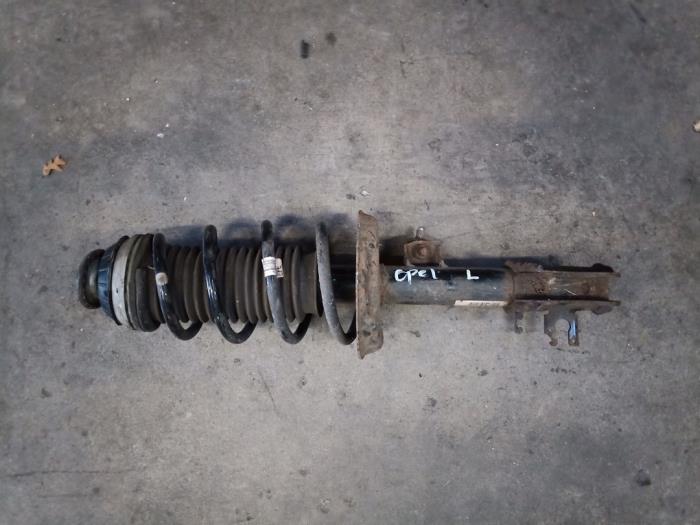 Front shock absorber rod, left from a Opel Corsa D 1.4 16V Twinport 2007