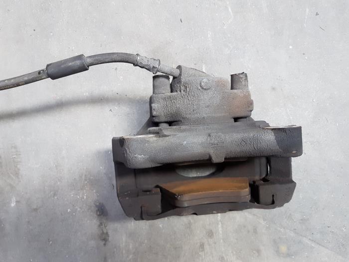 Front brake calliper, left from a Volkswagen Transporter T5 2.0 TDI DRF 2011