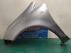 Front wing, left from a Opel Corsa D 1.2 16V 2007