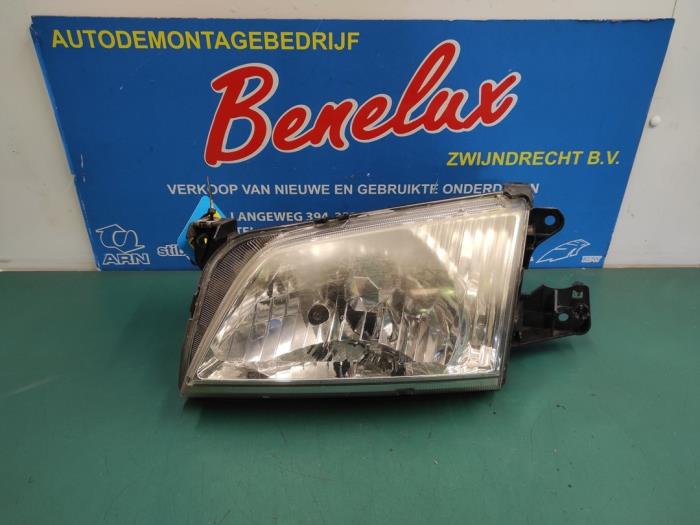 Używane Reflektor lewy Mazda Demio (DW) 1.5 16V Cena na żądanie oferowane przez Benelux Zwijndrecht B.V.