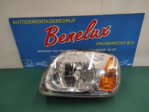 Używane Reflektor lewy Nissan Micra (K11) 1.4 16V Cena na żądanie oferowane przez Benelux Zwijndrecht B.V.