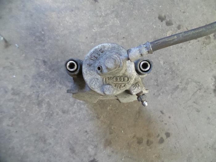 Front brake calliper, left from a Volkswagen Up! (121) 1.0 12V 75 2015