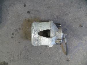 Used Front brake calliper, left Volkswagen Up! (121) 1.0 12V 75 Price on request offered by Autodemontage Joko B.V.