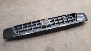 Used Grille Mazda Demio (DW) 1.3 16V Price on request offered by Autodemontage Joko B.V.