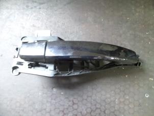 Used Rear door handle 4-door, right Opel Corsa D 1.4 16V Twinport Price on request offered by Autodemontage Joko B.V.