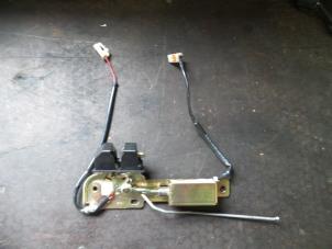 Used Tailgate lock mechanism Mazda 323 (BJ12) 1.3i 16V Price on request offered by Autodemontage Joko B.V.
