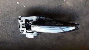Used Rear door handle 4-door, left Opel Astra H SW (L35) 1.9 CDTi 16V 120 Price on request offered by Autodemontage Joko B.V.