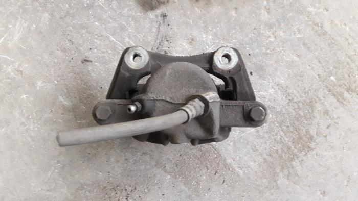 Front brake calliper, right from a Renault Clio III (BR/CR) 1.5 dCi 70 2008