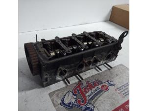 Used Cylinder head Citroen Saxo 1.6 VTR Price on request offered by Autodemontage Joko B.V.