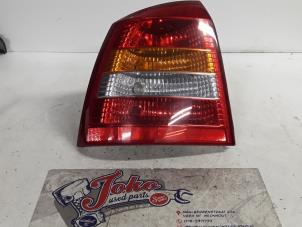 Used Taillight, left Opel Astra G (F08/48) 1.6 Price on request offered by Autodemontage Joko B.V.
