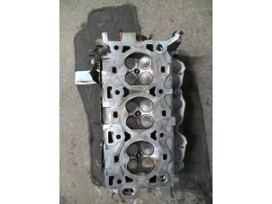 Used Cylinder head Ford Mondeo III 2.5 V6 24V Price on request offered by Autodemontage Joko B.V.