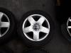 Set of sports wheels + winter tyres from a Volkswagen Polo Fun 1.2 12V 2004