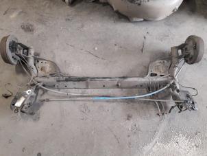 Used Rear-wheel drive axle Renault Clio III (BR/CR) 1.2 16V 75 Price on request offered by Autodemontage Joko B.V.