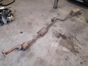 Used Exhaust central + rear silencer Renault Clio III (BR/CR) 1.2 16V 75 Price on request offered by Autodemontage Joko B.V.
