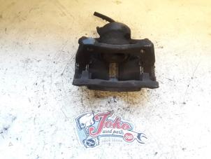 Used Front brake calliper, left Renault Clio III (BR/CR) 1.2 16V 75 Price on request offered by Autodemontage Joko B.V.