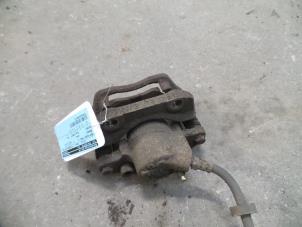 Used Front brake calliper, left Renault Twingo (C06) 1.2 16V Price on request offered by Autodemontage Joko B.V.