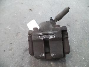Used Front brake calliper, left Renault Twingo II (CN) 1.2 16V Price on request offered by Autodemontage Joko B.V.