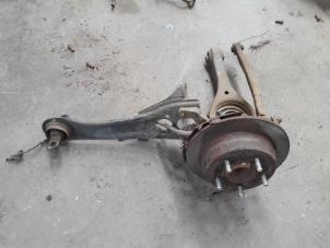 Used Rear suspension system, left Kia Cee'd Sporty Wagon (EDF) 1.4 16V Price on request offered by Autodemontage Joko B.V.