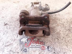 Used Rear brake calliper, left Opel Tigra Twin Top 1.8 16V Price on request offered by Autodemontage Joko B.V.