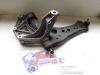 Front lower wishbone, left from a Seat Ibiza III (6L1) 1.2 12V 2007