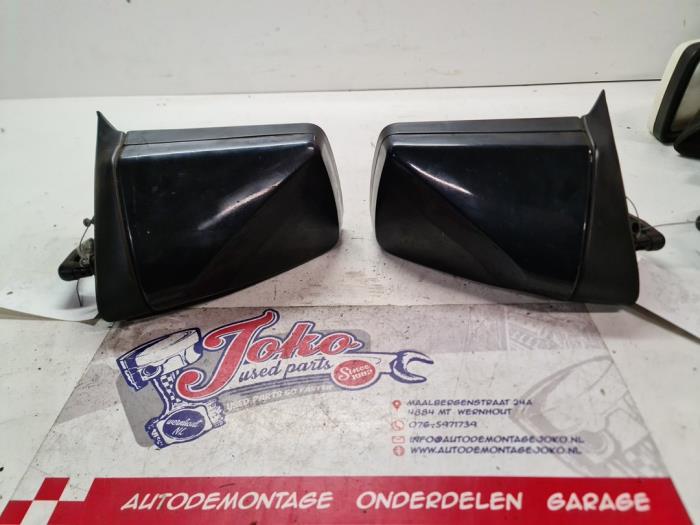 Wing mirror, left from a Opel Corsa A 1.2 i Kat. 1993