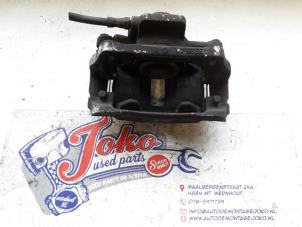 Used Front brake calliper, left Mini Mini (R56) 1.6 One D 16V Price on request offered by Autodemontage Joko B.V.