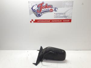 Used Wing mirror, left Mitsubishi Colt (C5) 1.3 12V Kat. Price on request offered by Autodemontage Joko B.V.