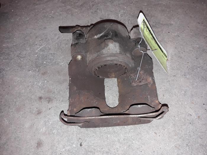 Front brake calliper, left from a Volvo 850 Estate 2.5i 10V 1995